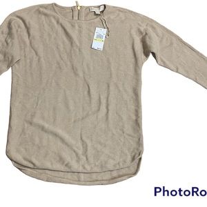 Tan Michael Kors sweater with a gold back zipper.